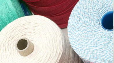 Nikol Weber offers technical yarns and twines, like tying strings for sausage rings and plaited twine in natural white or coloured on conical and cylindrical bobbins, in polyester, cotton or polypropylene