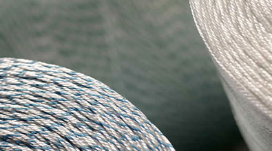 Nikol Weber offers technical yarns und twines as technical lacing cords such as polyester filament yarn in natural white or coloured on conical and cylindrical bobbins